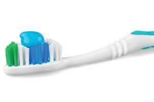 toothbrush with toothpaste on it